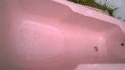 Pink BATH WITH MIXER TAPS AND SIDE PANEL